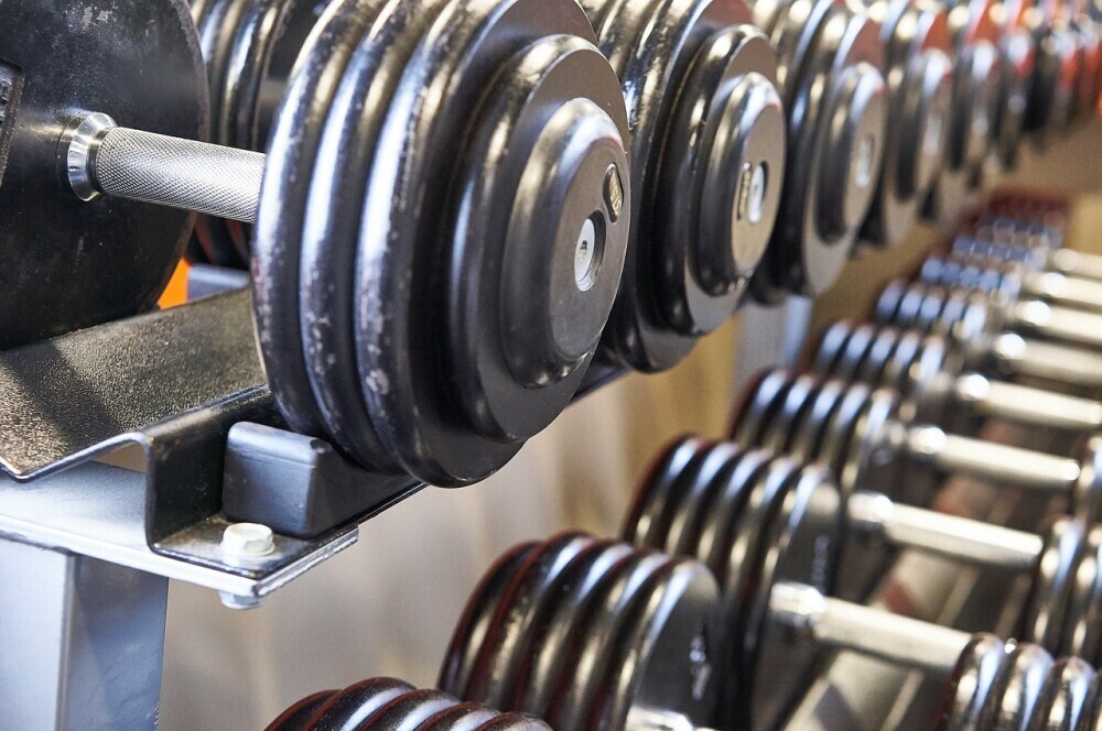 stack full of rows of dumbbells