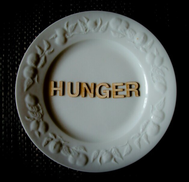 the word hunger spelled on a plate