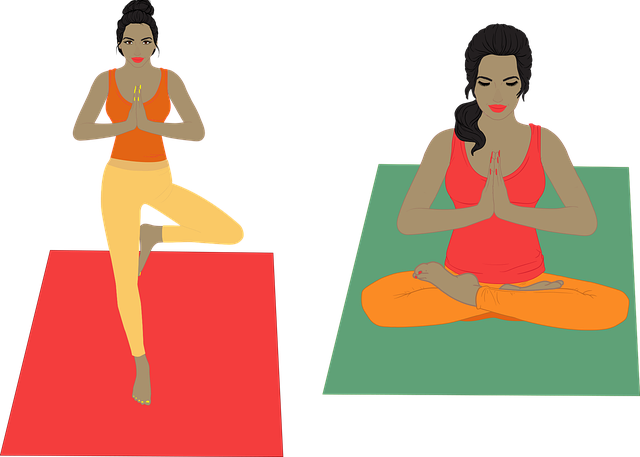 two women practicing yoga